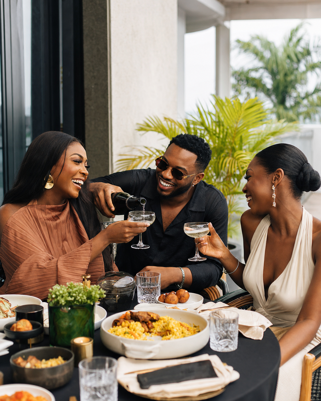 Nigerian friends sharing champagne and brunch at KOVA